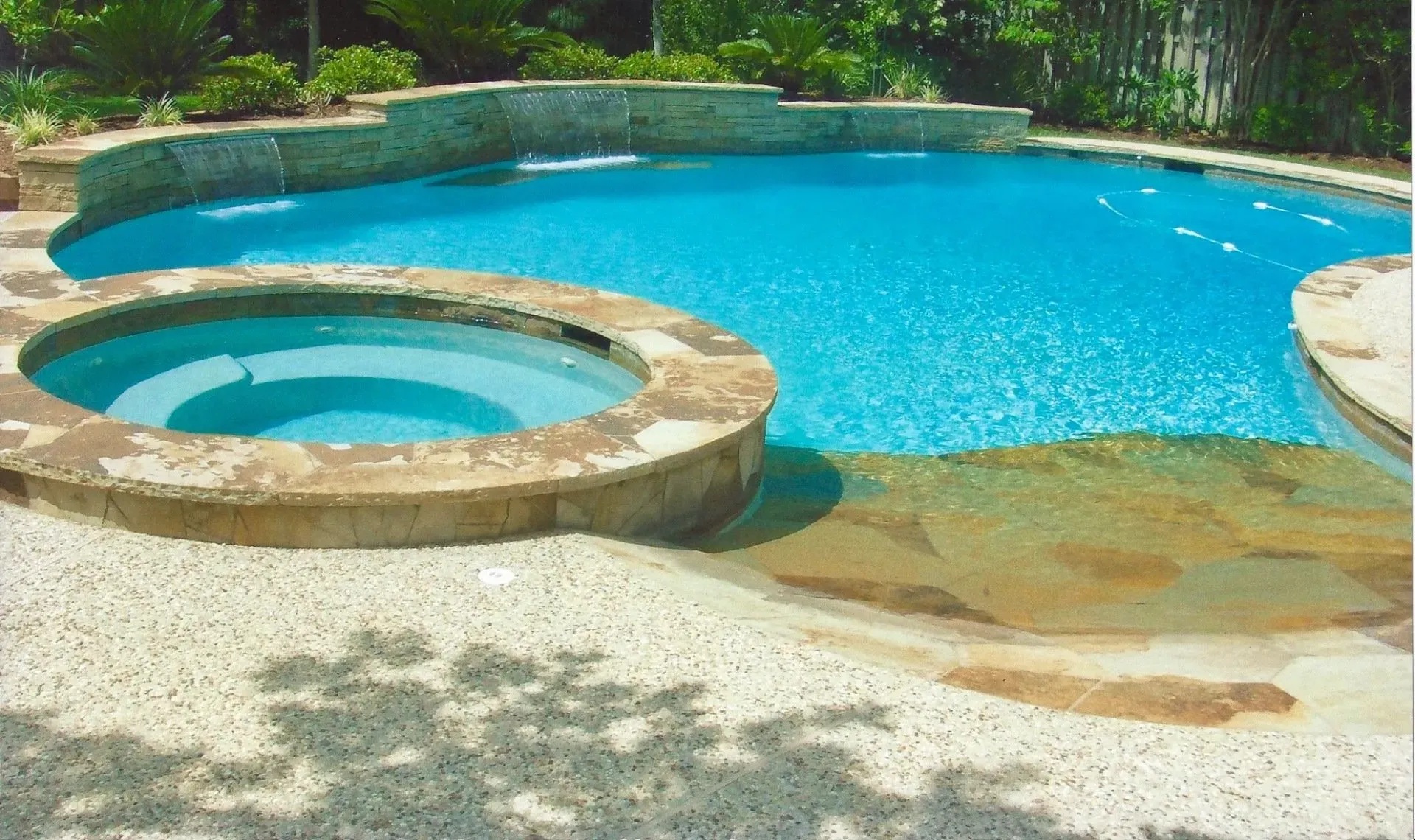 Pool With Sitting Shelf, Stonework, Waterfalls, Hot Tub