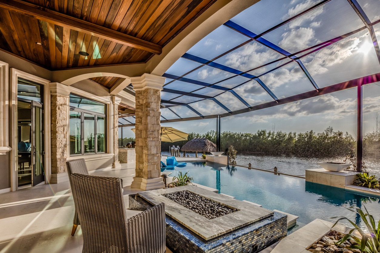 Firepit in Screen Covered Patio with Pool