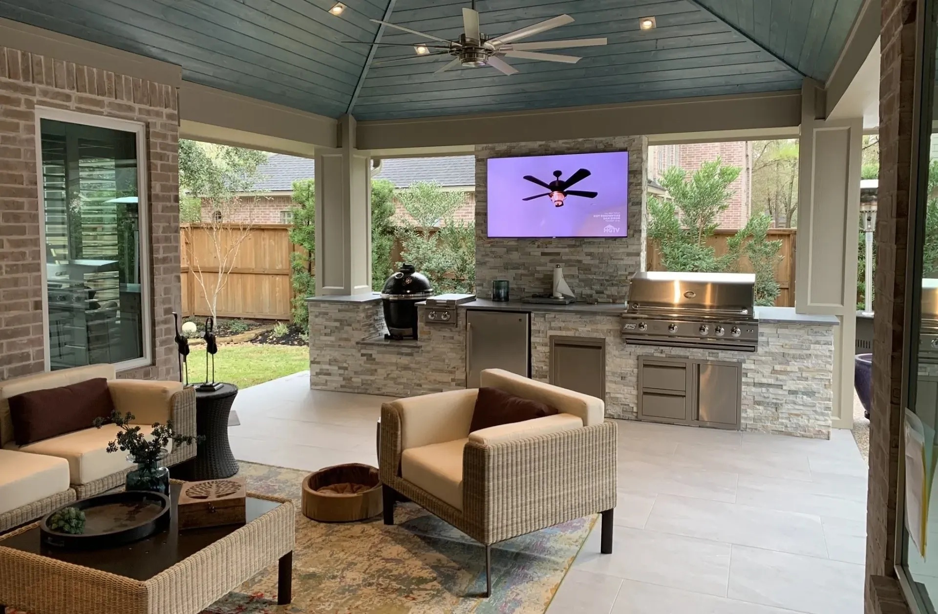 Outdoor Covered Living Room and Kitchen with TV